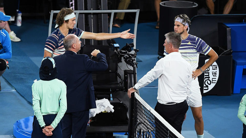 Alexander Zverevpoints to Dominic Thiemduring a delay at the Australian Open.