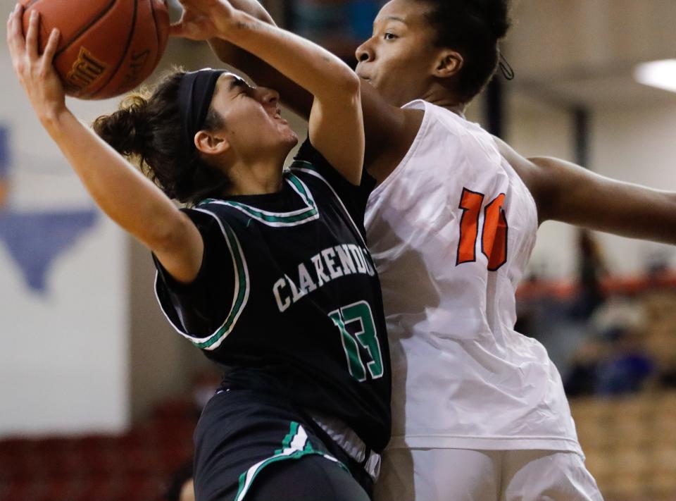 South Plains College forward Vitoria Carvalho, at right in a game earlier this season, scored 12 points Monday night, but the Lady Texans lost at Odessa College 61-46.