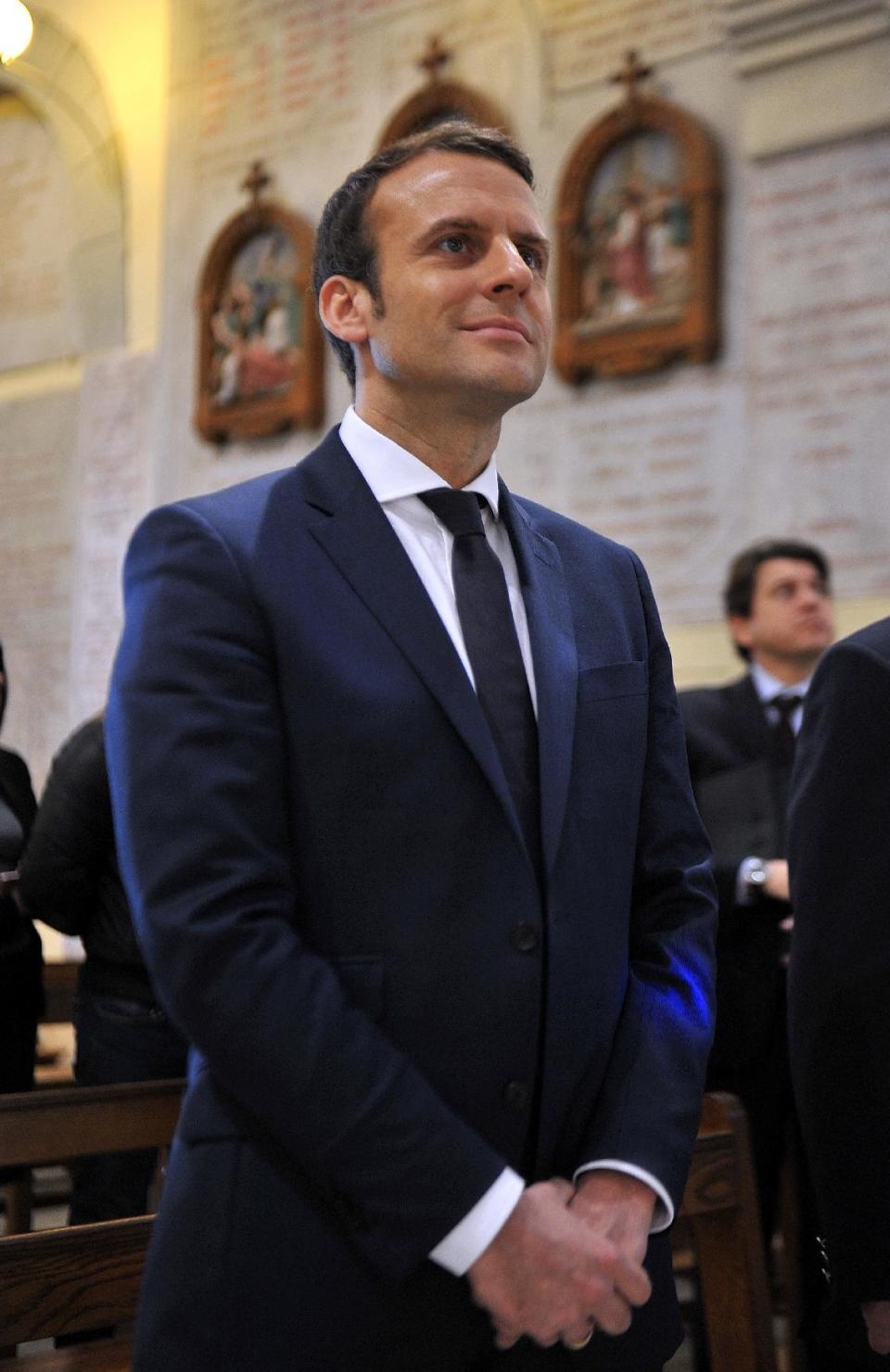 French Presidential candidate Emmanuel Macron visists the Notre-Dame d'Afrique basilica in Algiers, Tuesday Feb. 14, 2017. Macron ends his two-day visit to Algeria. (AP Photo/Anis Belghoul)