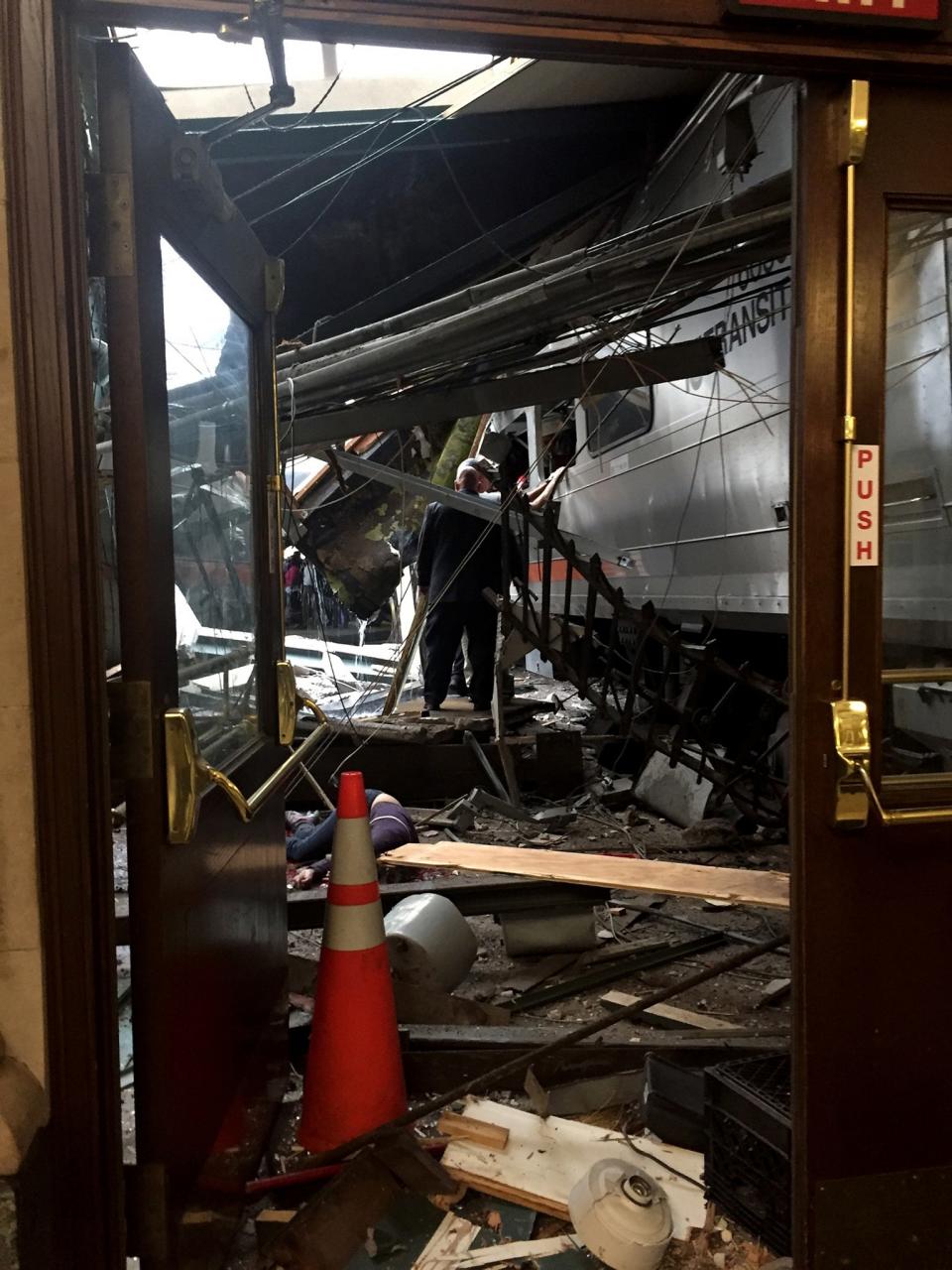<p>A NJ Transit train seen through the wreckage after it crashed in to the platform at the Hoboken Terminal September 29, 2016 in Hoboken, New Jersey. (Pancho Bernasconi/Getty Images) </p>