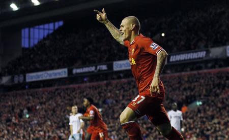 Liverpool's Martin Skrtel celebrates after his team scored during their English Premier League soccer match against West Ham United at Anfield in Liverpool, northern England December 7, 2013. REUTERS/Phil Noble