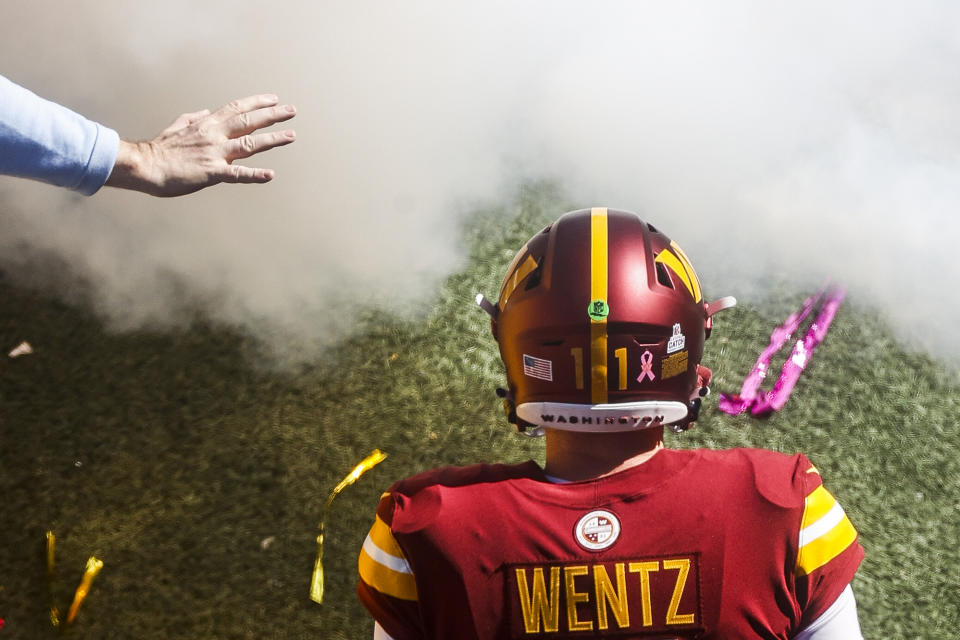 CORRECTS STATE TO MD NOT VA Washington Commanders quarterback Carson Wentz (11) takes the field before an NFL football game against the Tennessee Titans Sunday, Oct. 9, 2022 in Landover, Md. (Shaban Athuman/Richmond Times-Dispatch via AP)