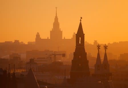 View shows building of Moscow State University and tower of Kremlin in Moscow