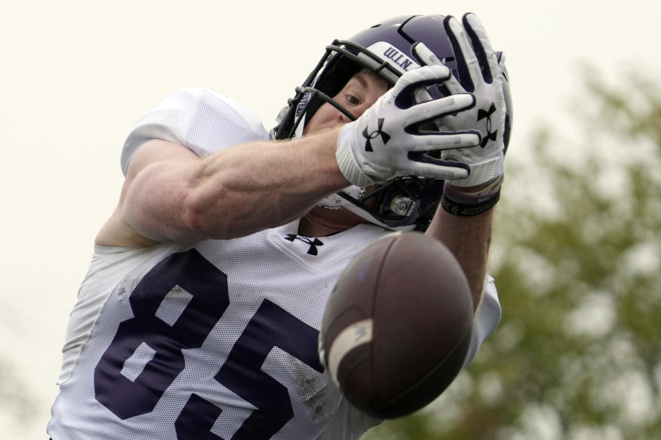 Northwestern wide receiver Jack Kennedy misses a catch during team's practice in Evanston, Ill., Wednesday, Aug. 9, 2023. (AP Photo/Nam Y. Huh)