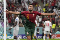 Portugal's Goncalo Ramos celebrates after scoring his side's fifth goal during the World Cup round of 16 soccer match between Portugal and Switzerland, at the Lusail Stadium in Lusail, Qatar, Tuesday, Dec. 6, 2022. (AP Photo/Alessandra Tarantino)