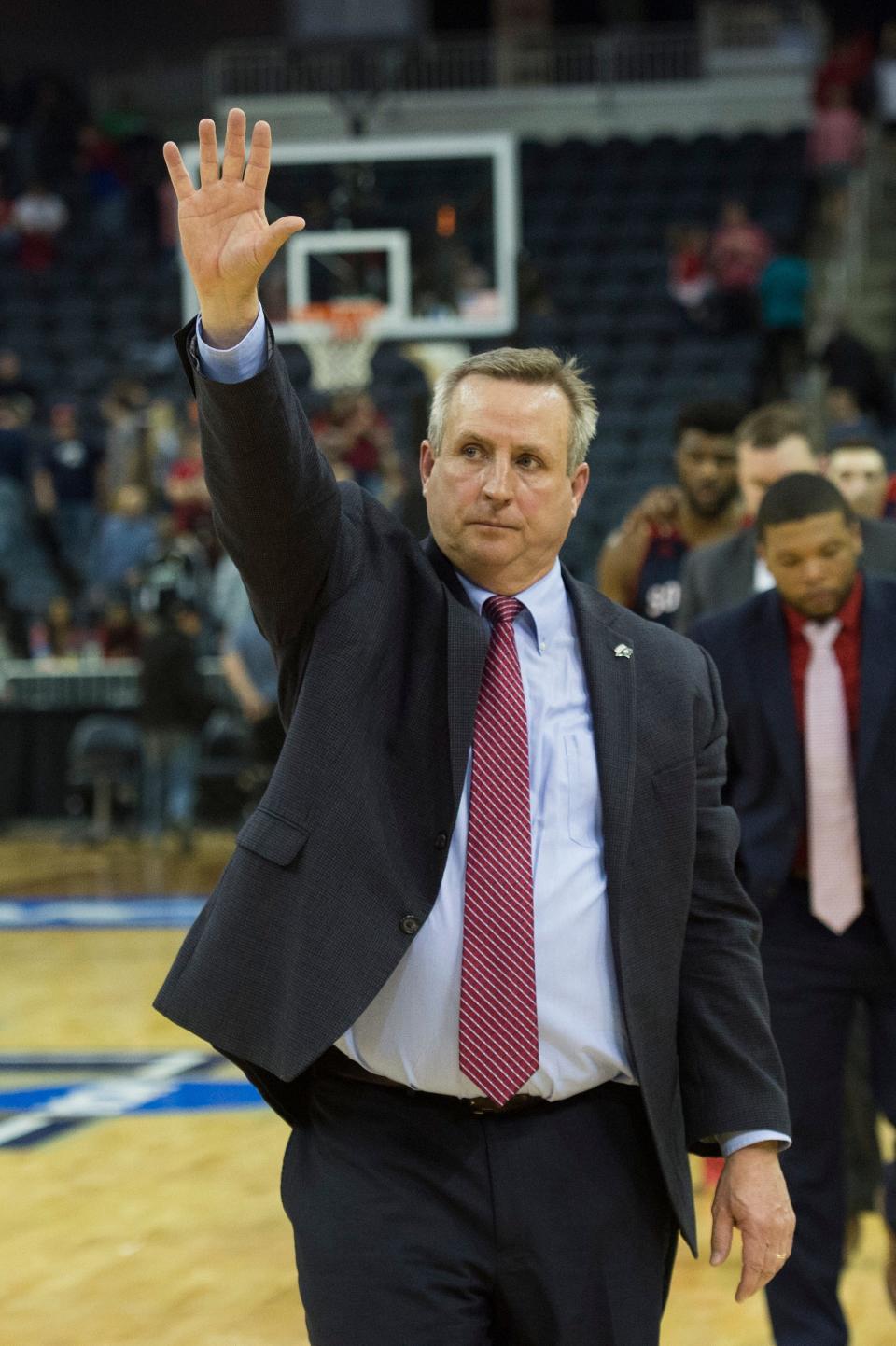 University of Southern Indiana Head Coach Rodney Watson waves to the crowd as he leaves the court during the NCAA Division II Final Four men's basketball tournament at Ford Center in Evansville, Ind., Thursday, March 28, 2019. The Screaming Eagles fell to the Point Loma Sea Lions, 81-71. 