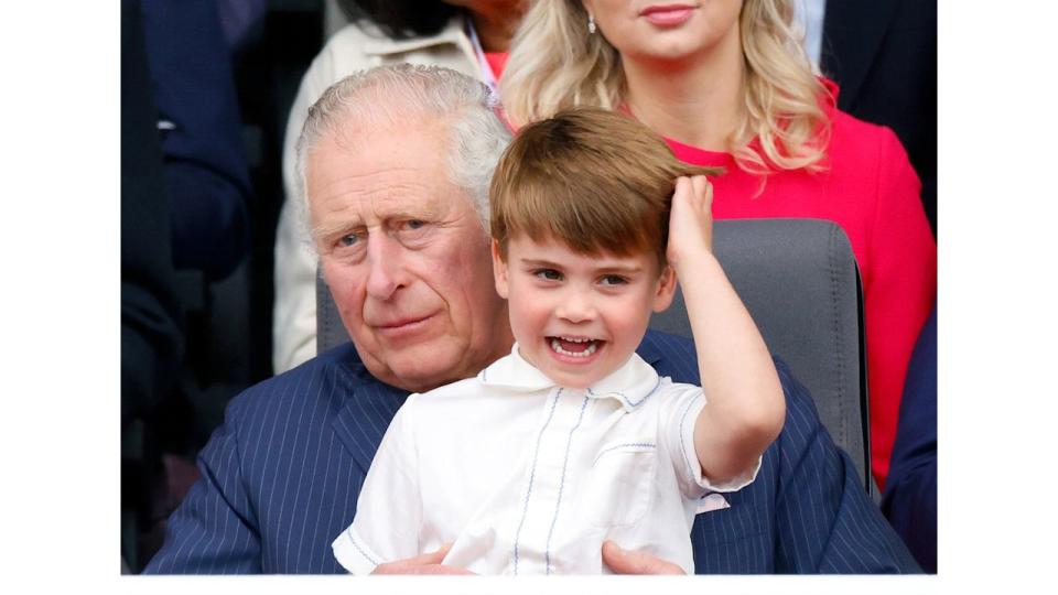 King Charles with Prince Louis sat on his lap