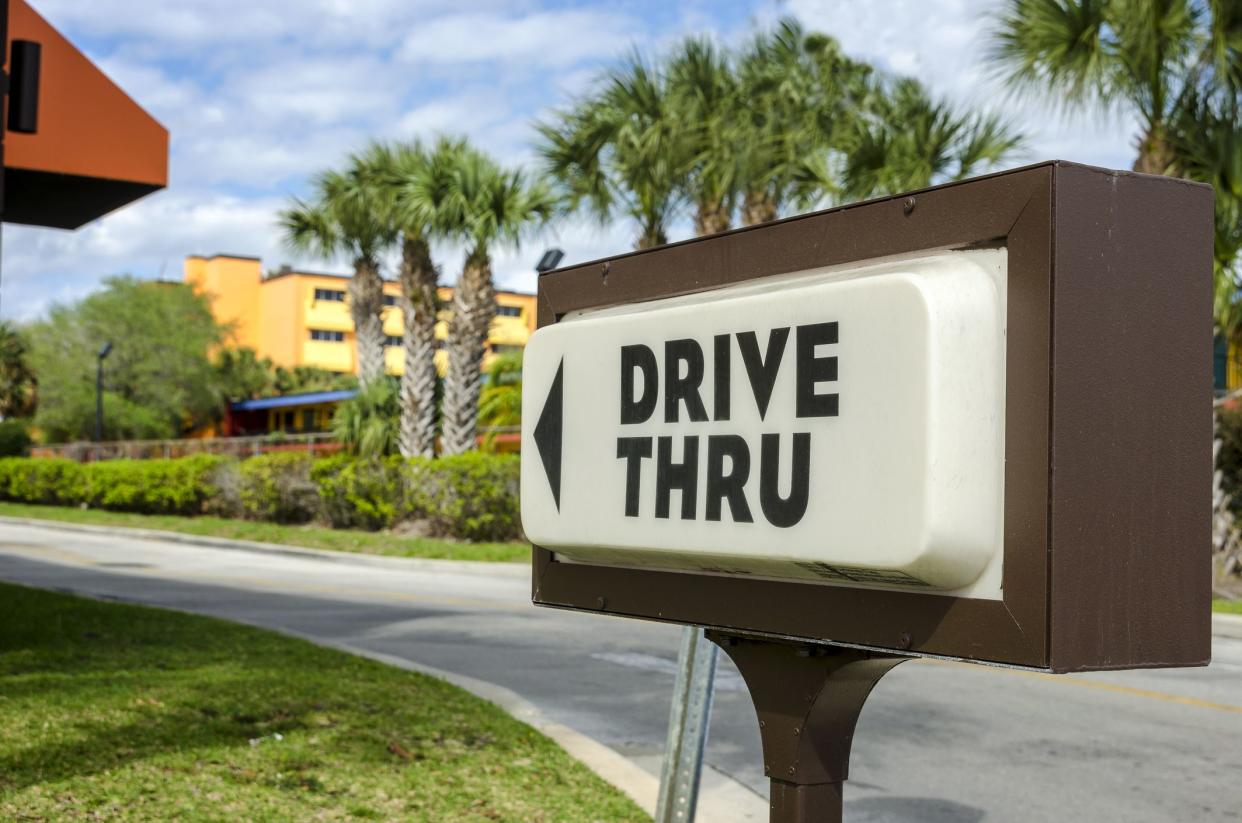 A drive thru sign advertising a fast food restaurant