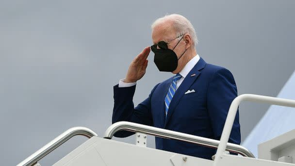 PHOTO: President Joe Biden salutes as he makes his way to board Air Force One before departing from Andrews Air Force Base in Maryland, April 12, 2022. (Mandel Ngan/AFP via Getty Images)