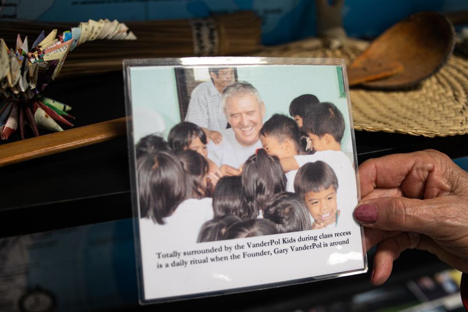 In this photograph, Gary VanderPol is surrounded by children who attend the school built in memory of Gary's son, Tom VanderPol, in Guatemala.