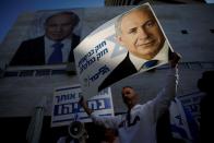 Supporters of Israeli Prime Minister Benjamin Netanyahu protest outside Likud Party headquarters in Tel Aviv