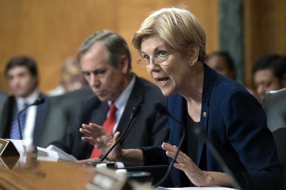 FILE- In this Sept. 20, 2016, file photo, Senate Banking Committee member Sen. Elizabeth Warren, D-Mass., questions Wells Fargo Chief Executive Officer John Stumpf on Capitol Hill in Washington. Warren is leading a new effort to make sure vendors working with marijuana businesses don't have their banking services taken away. (AP Photo/Susan Walsh, File)