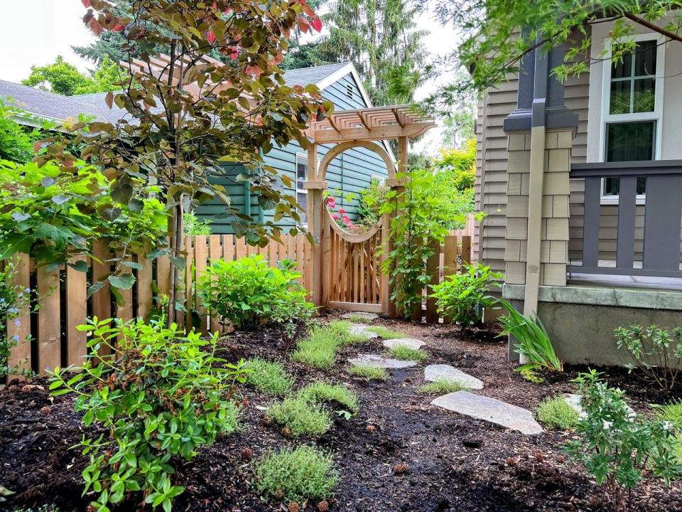 a small garden in front of a house