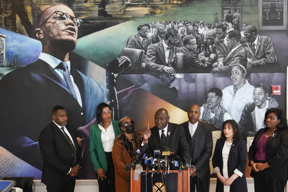 Accompanied by attorneys and members of Malcolm X's family, attorney Ben Crump, center, speaks during a news conference at the Malcolm X & Dr. Betty Shabazz Memorial and Educational Center in New York, Tuesday, Feb. 21, 2023. Some of Malcom X's family members and their attorneys announced their intent to sue governmental agencies for Malcom X's assassination and the fraudulent concealment of evidence surrounding the murder. In 1965, the minister and civil rights activist was shot to death inside Harlem's Audubon Ballroom in New York. (AP Photo/Seth Wenig)