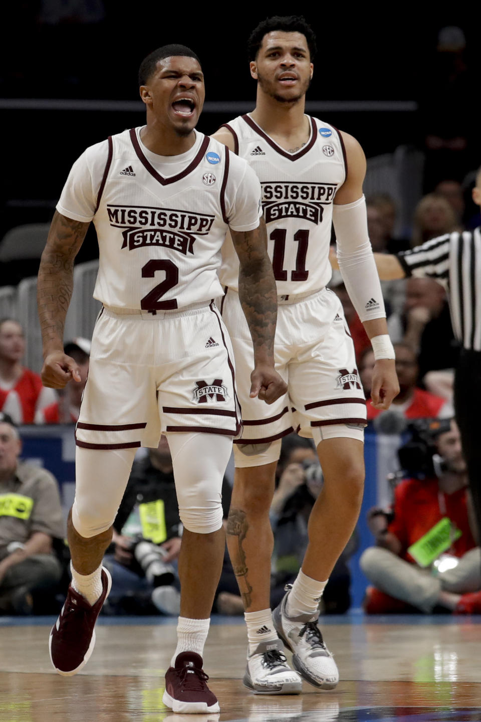 Mississippi State guard Lamar Peters, left, celebrates after scoring during the second half against Liberty in a first-round game in the NCAA men’s college basketball tournament Friday, March 22, 2019, in San Jose, Calif. (AP Photo/Jeff Chiu)