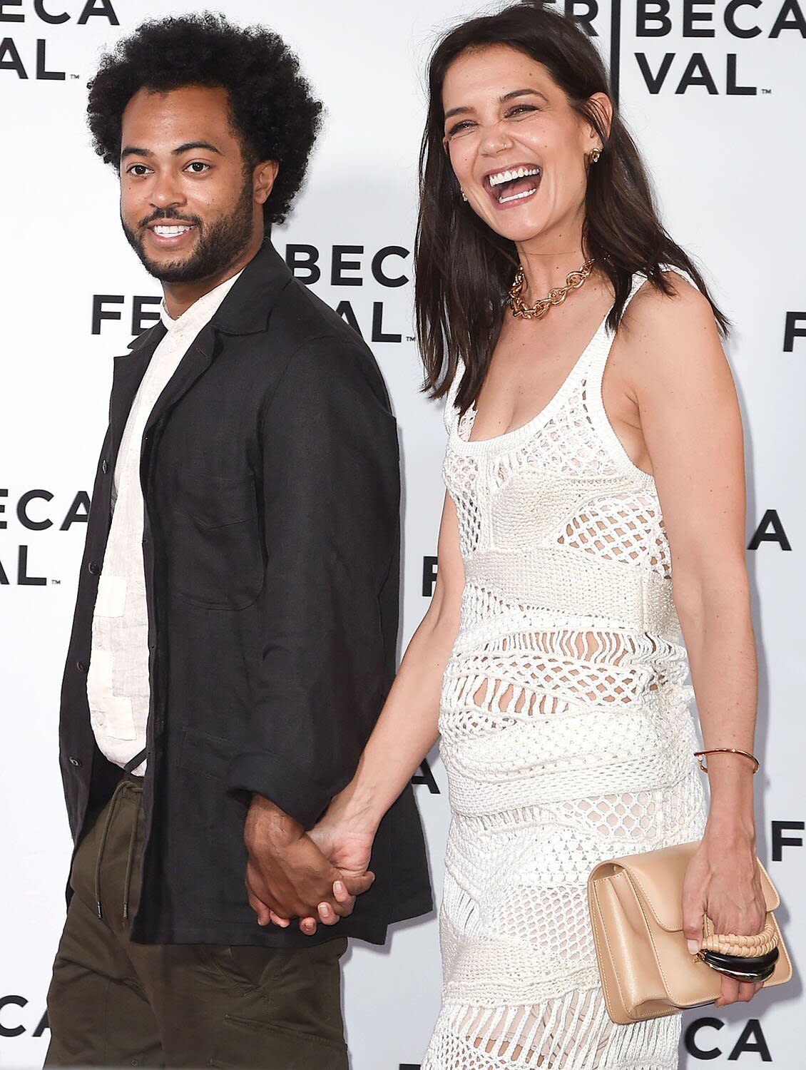 06/14/2022 Katie Holmes and Bobby Wooten III hold hands on the red carpet in New York City. The 43 year old American actress and her beau attended the premiere of Alone Together held at the Tribeca Film Festival in NYC. sales@theimagedirect.com Please byline:TheImageDirect.com