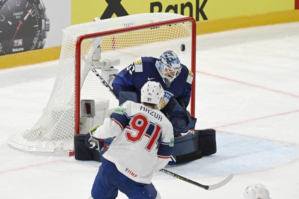 United States forward Carter Mazur sees the puck go into the bet past goalkeeper Finland's goalkeeper Emil Larmi during the IIHF World Championships match between Finland and the United States in Tampere, Finland, on Friday, May 12, 2023.