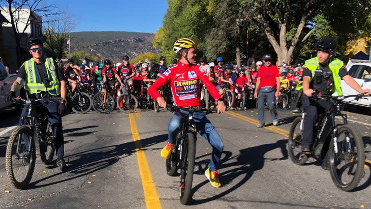 <span class="article__caption">Sepp Kuss rides at the head of a massive citizens ride in Durango. </span>