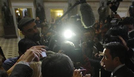 U.S. Representative Michael Grimm (R-NY) (R) talks to the media after meeting with House Speaker John Boehner (R-OH) to discuss the relief fund hold up in Congress for Hurricane Sandy victims at the United States Capitol in Washington January 2, 2013. REUTERS/Gary Cameron