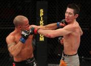 Josh Clopton hits Steven Siler with a punch during The Ultimate Fighter 14 Finale at the Pearl Theatre at the Palms Hotel and Casino on December 3, 2011 in Las Vegas, Nevada. (Photo by Josh Hedges/Zuffa LLC/Zuffa LLC via Getty Images)