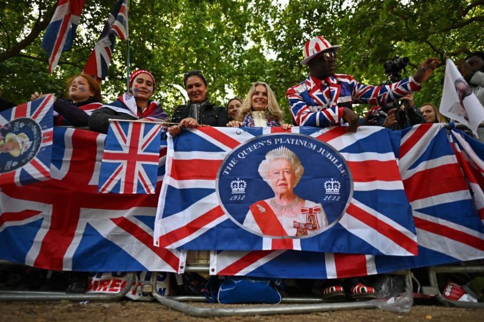 <p>Fans gather along The Mall ahead of the Trooping the Colour parade.</p>