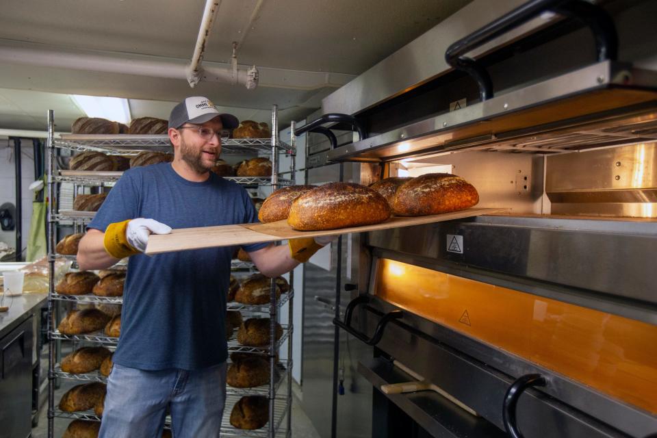 Travis Coatney bakes sourdough bread in the Atlantic Highlands kitchen that's home to his company, Benchmark Breads.