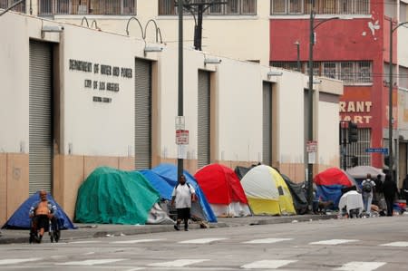 Tents and tarps erected by homeless people are shown along the sidewalks in the skid row area of downtown Los Angeles, California