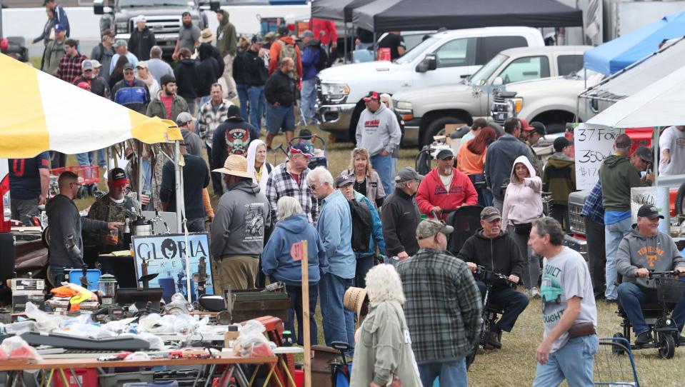 Classic-car enthusiasts look for specality items on Friday at the swap meet as part of the 50th annual fall Turkey Run at Daytona International Speedway. The event runs through Sunday in Daytona Beach.