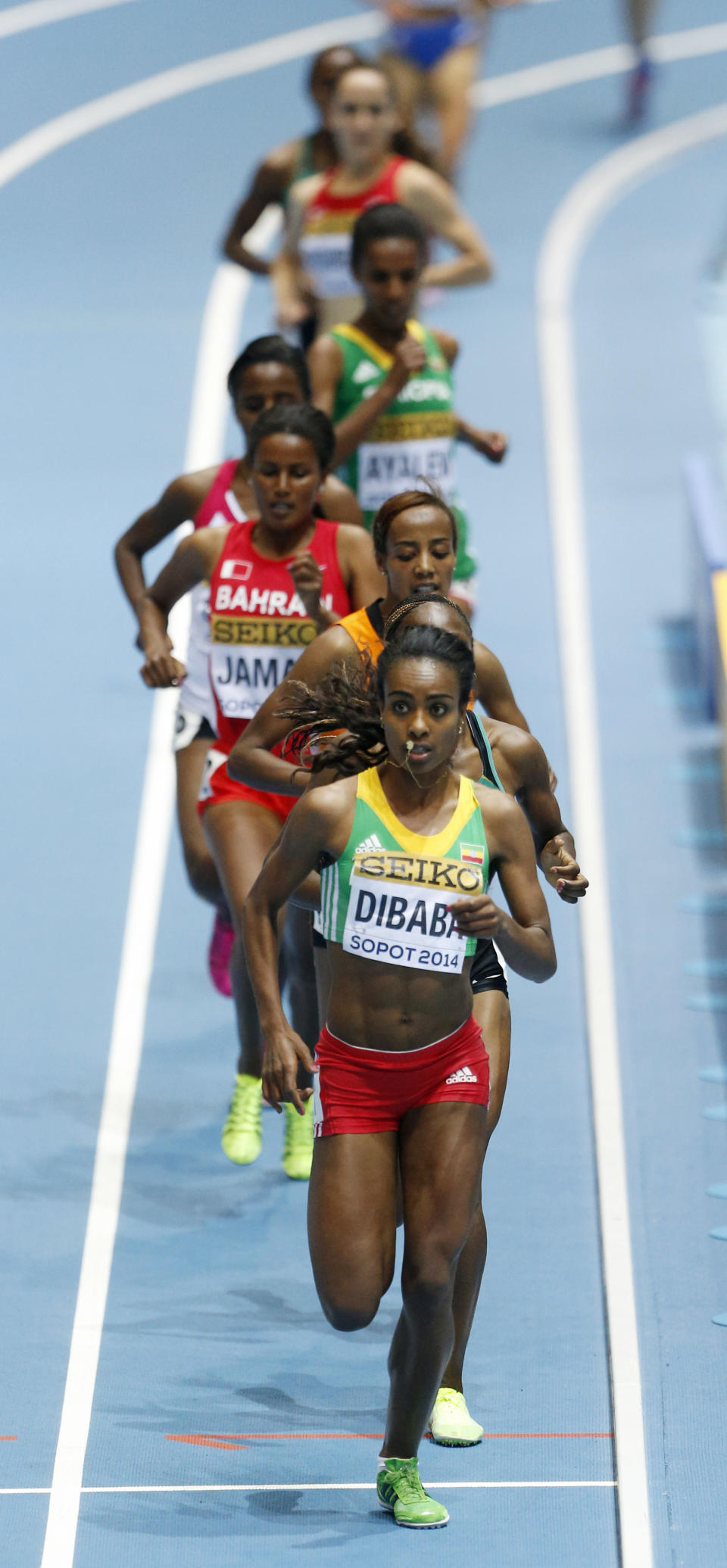 Ethiopia's Genzebe Dibaba leads the field to win the women's 3000m final during the Athletics World Indoor Championships in Sopot, Poland, Sunday, March 9, 2014. (AP Photo/Petr David Josek)