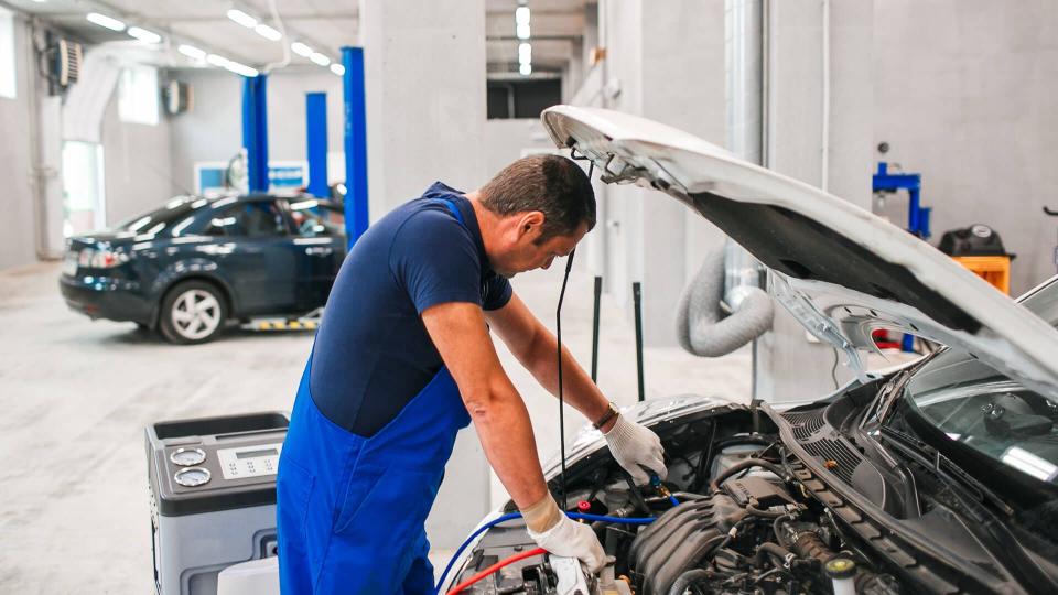 mechanic repairing car