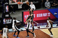 Memphis Grizzlies center Jonas Valanciunas (17) shoots over San Antonio Spurs forward Rudy Gay (22) during the first half of an NBA basketball Western Conference play-in game Wednesday, May 19, 2021, in Memphis, Tenn. (AP Photo/Brandon Dill)