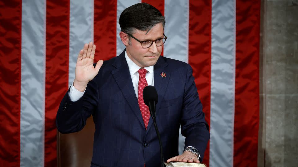 Newly elected Speaker of the House Mike Johnson takes his oath of office in the US Capitol. Johnson is an evangelical Christian. - Chip Somodevilla/Getty Images