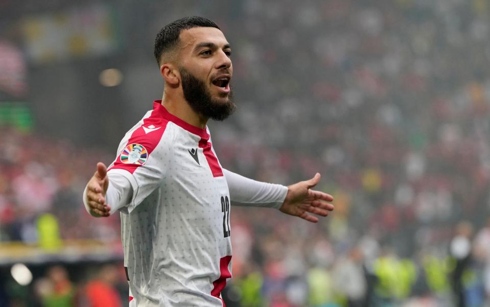 Georges Mikautadze celebrates Georgia's equaliser