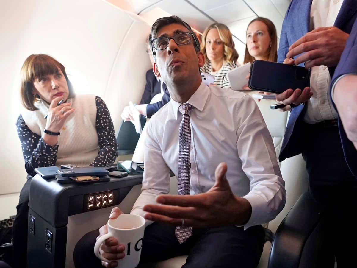 Rishi Sunak holds a huddle with political journalists on plane heading to US (PA)