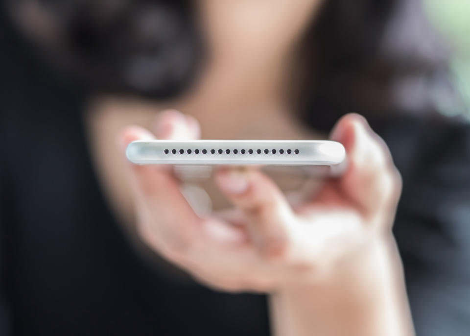 A stock image of a person holding a cell phone