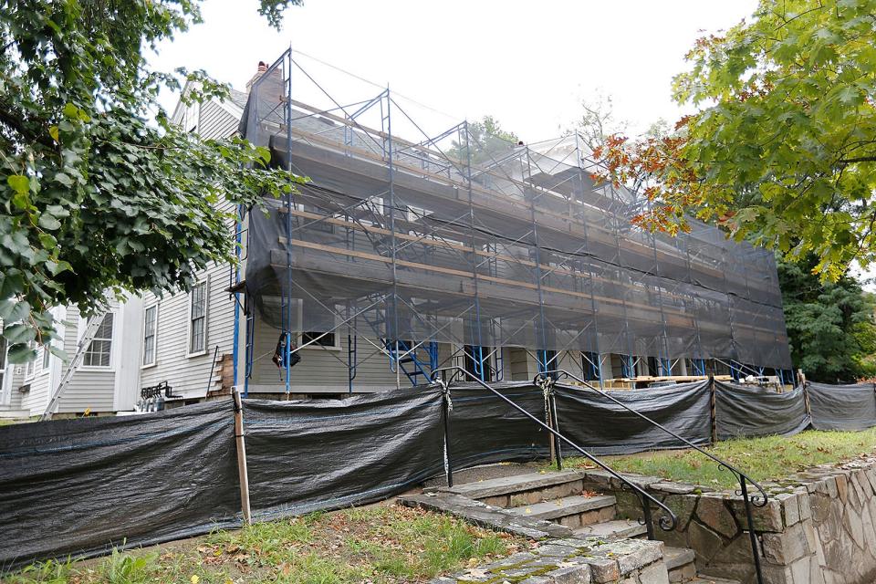 The historical Norton House is being restored by developer John Barry and eight new condominiums are under construction behind the existing building.