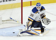 St. Louis Blues goaltender Ville Husso deflects the puck during the first period of the team's NHL hockey game against the Vegas Golden Knights on Saturday, May 8, 2021, in Las Vegas. (AP Photo/David Becker)