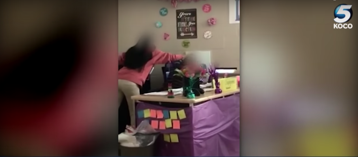 A student at U.S. Grant High School in Oklahoma smashed an egg on her teacher’s head in a video. (Screenshot: YouTube: KOCO-5)