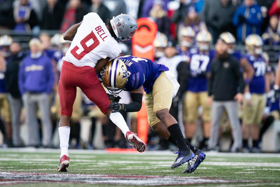 SEATTLE, WA - NOVEMBER 29: Washington State Cougars wide receiver Renard Bell (9) is hit hard by Washington Huskies defensive back Elijah Molden (3) after a reception in the second half of the 112th Apple Cup between the Washington Huskies and the Washington State Cougars on Friday, November 29, 2019 at Husky Stadium in Seattle, WA. (Photo by Christopher Mast/Icon Sportswire via Getty Images)