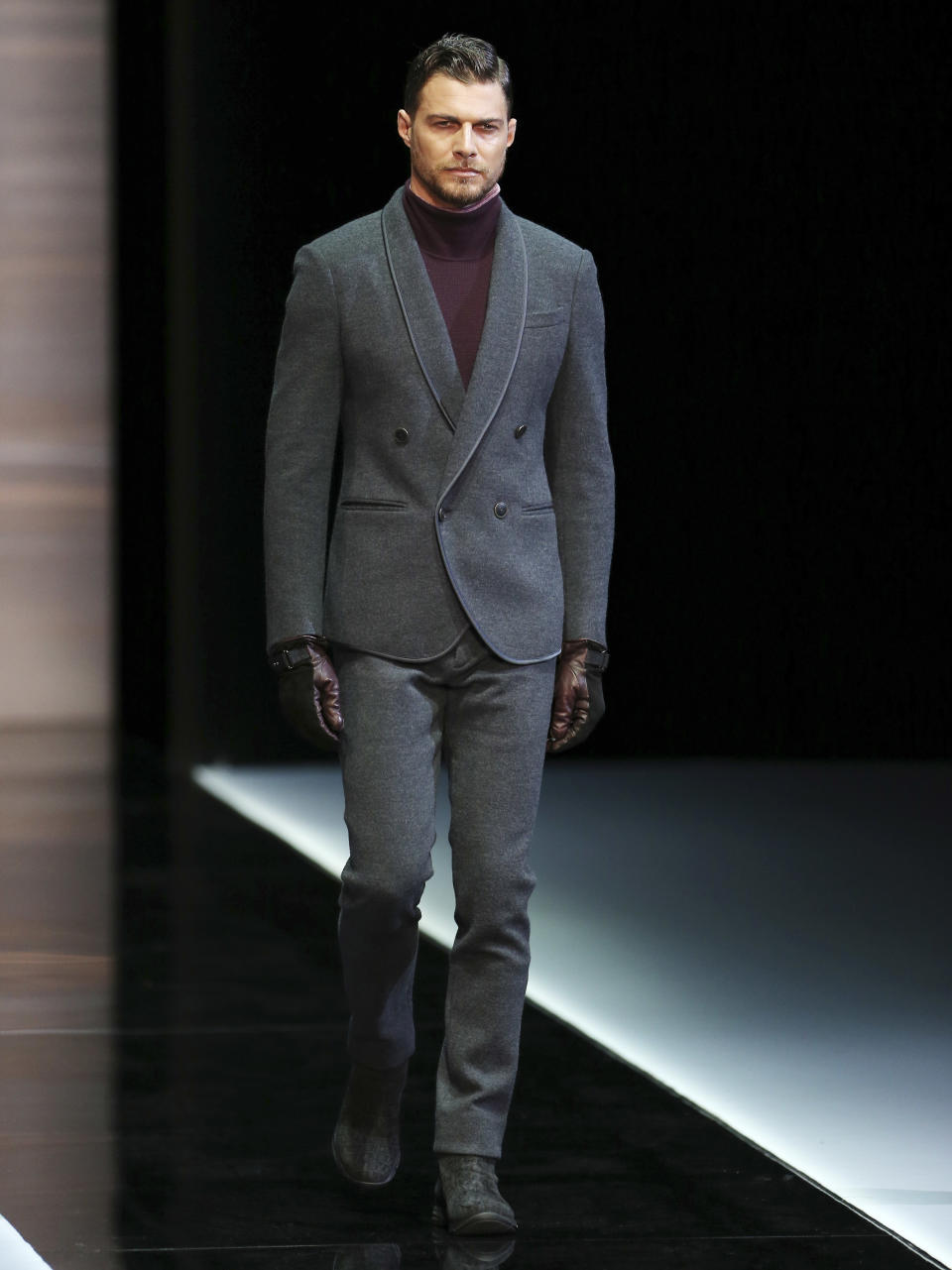 A model wears a creation for Giorgio Armani men's Fall-Winter 2013-14 collection, part of the Milan Fashion Week, unveiled in Milan, Italy, Tuesday, Jan. 15, 2013. (AP Photo/Antonio Calanni)