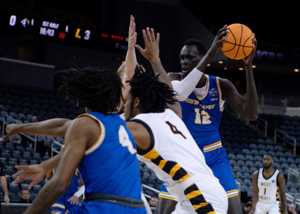 New Haven's Majur Majak (12) looks to pass against West Liberty during their NCAA Division II quarterfinal game at Ford Center in Evansville, Ind., Tuesday afternoon, March 21, 2023.