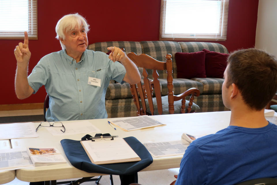 Democratic organizer Bill Chandler talks with a volunteer about how to speak with voters when distributing campaign material in Wisconsin on Saturday, Sept. 21, 2019, in Whitewater, Wis. Chandler is executing the Democratic strategy to win back Wisconsin _ a block-by-block rebuilding of the infrastructure they let crumble ahead of the last presidential election. Many Democrats in Wisconsin, and across the Rust Belt states that President Donald Trump flipped Republican in 2016, believe their weak neighborhood network contributed to their defeat. (AP Photo/Scott Bauer)