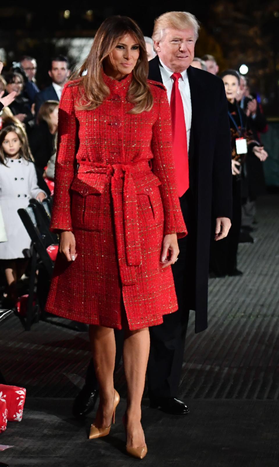 <p>Melania Trump donned a red boucle Chanel coat to light the national Christmas tree, pairing the woven look with nude Louboutin stilettos. <i>[Photo: Getty]</i> </p>