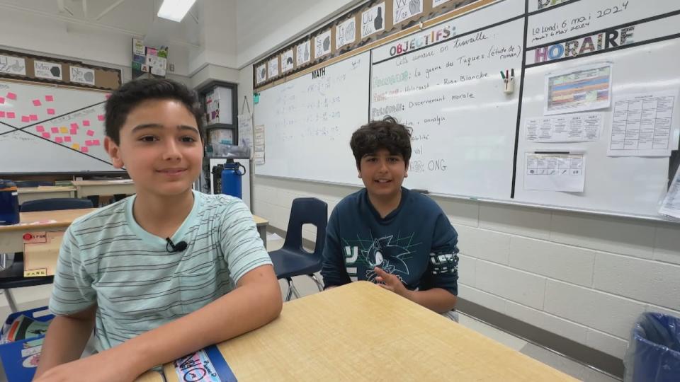 Zane Bassam and Tony Elsoury. Tony choked on a bite of pasta last week — but thanks to first-aid training students received in class, Zane was able to perform the Heimlich maneuvere. 