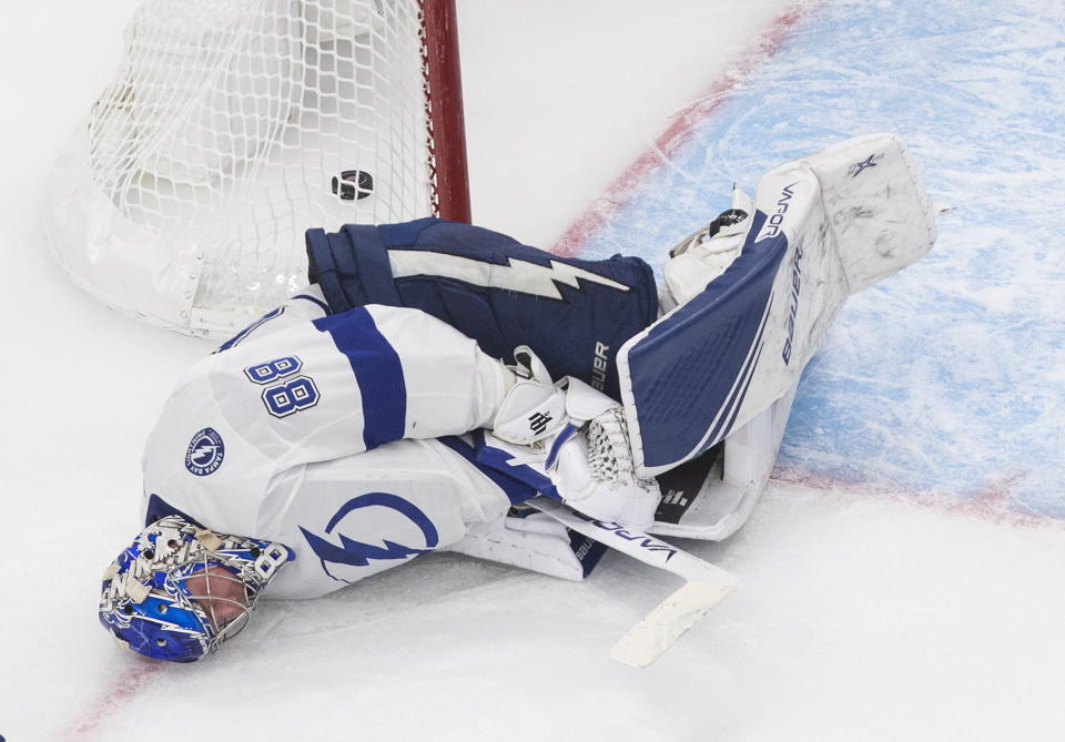 Tampa Bay Lightning goalie Andrei Vasilevskiy (88) lies on the ice after giving up a goal to the New York Islanders during the second period of Game 3 of the NHL hockey Eastern Conference final, Friday, Sept. 11, 2020, in Edmonton, Alberta. (Jason Franson/The Canadian Press via AP)