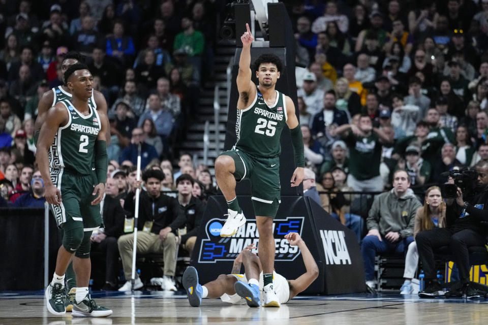 Michigan State forward Malik Hall (25) celebrates a turnover by Marquette in the second half of a second-round college basketball game in the men's NCAA Tournament in Columbus, Ohio, Sunday, March 19, 2023. (AP Photo/Michael Conroy)