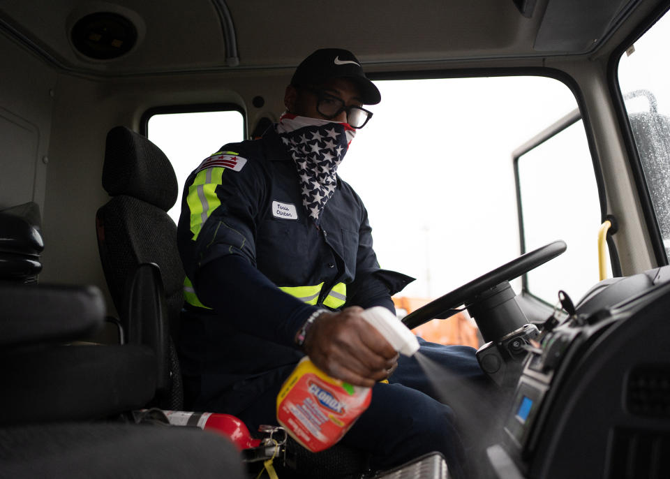 Tavis Clinton disinfects his truck before beginning his route on May 22. | Nate Palmer for TIME