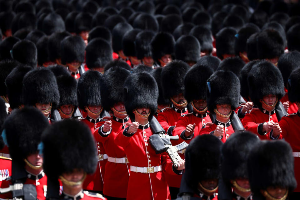 <div class="inline-image__caption"><p>Household Division foot guards march in the Trooping the Color parade in celebration of Britain's Queen Elizabeth's Platinum Jubilee, in London, Britain June 2, 2022.</p></div> <div class="inline-image__credit">REUTERS/Henry Nicholls</div>