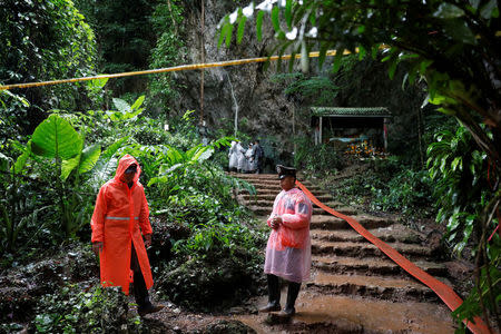 Rescue workers are seen near Tham Luang cave complex during a search for members of an under-16 soccer team and their coach, in the northern province of Chiang Rai, Thailand, June 28, 2018. REUTERS/Soe Zeya Tun