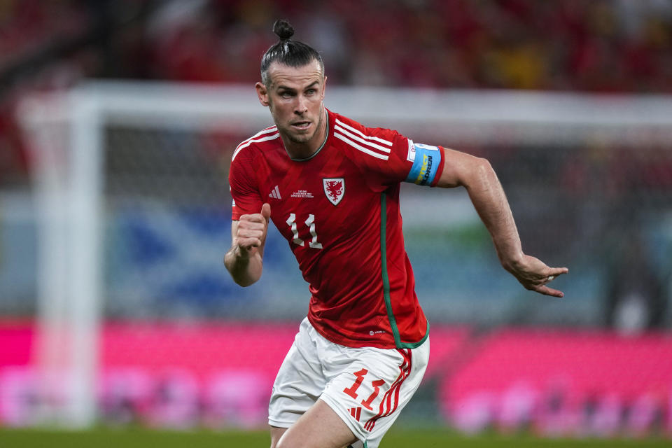 Wales' Gareth Bale runs during the World Cup group B soccer match between England and Wales, at the Ahmad Bin Ali Stadium in Al Rayyan , Qatar, Tuesday, Nov. 29, 2022. (AP Photo/Frank Augstein)